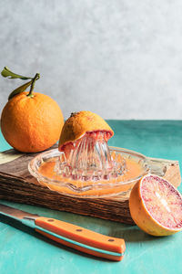 Close-up of orange fruit on table