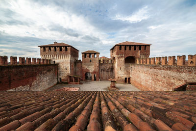 Old building against cloudy sky