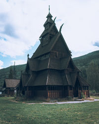 Old building on field against sky