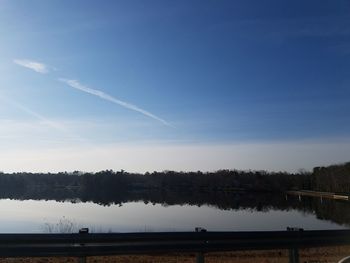 Scenic view of vapor trails in sky