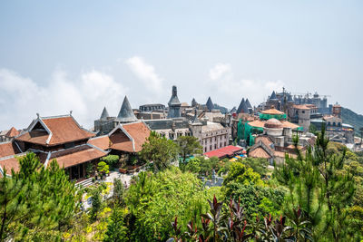 View of buildings against cloudy sky