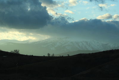 Scenic view of silhouette landscape against sky