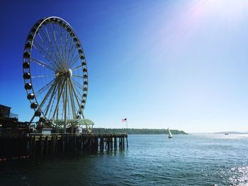 Seattle great wheel with american flag against clear sky