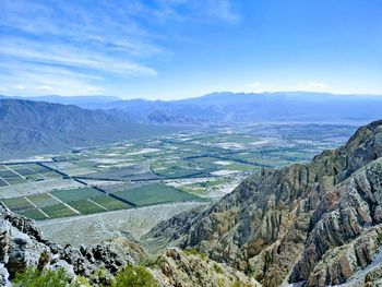 Aerial view of landscape and mountains against sky