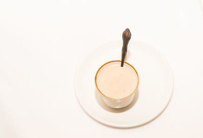 Directly above shot of coffee cup over white background