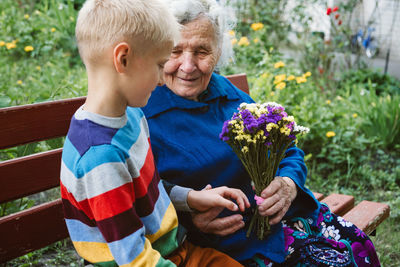 Reunited, family, togetherness, relationships, meeting, embracing. grandson visit grandmother 