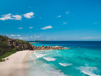 Scenic view of sea against blue sky