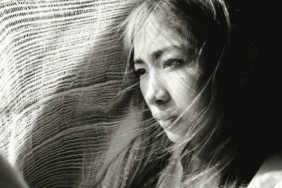 Close-up portrait of woman looking away