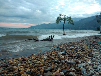 Scenic view of sea against cloudy sky