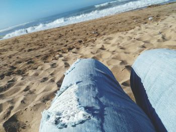 Cropped image of person at beach