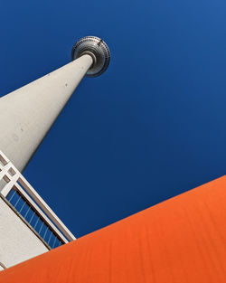 Low angle view of building against clear blue sky