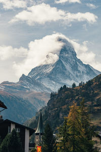Scenic view of snowcapped mountains against sky