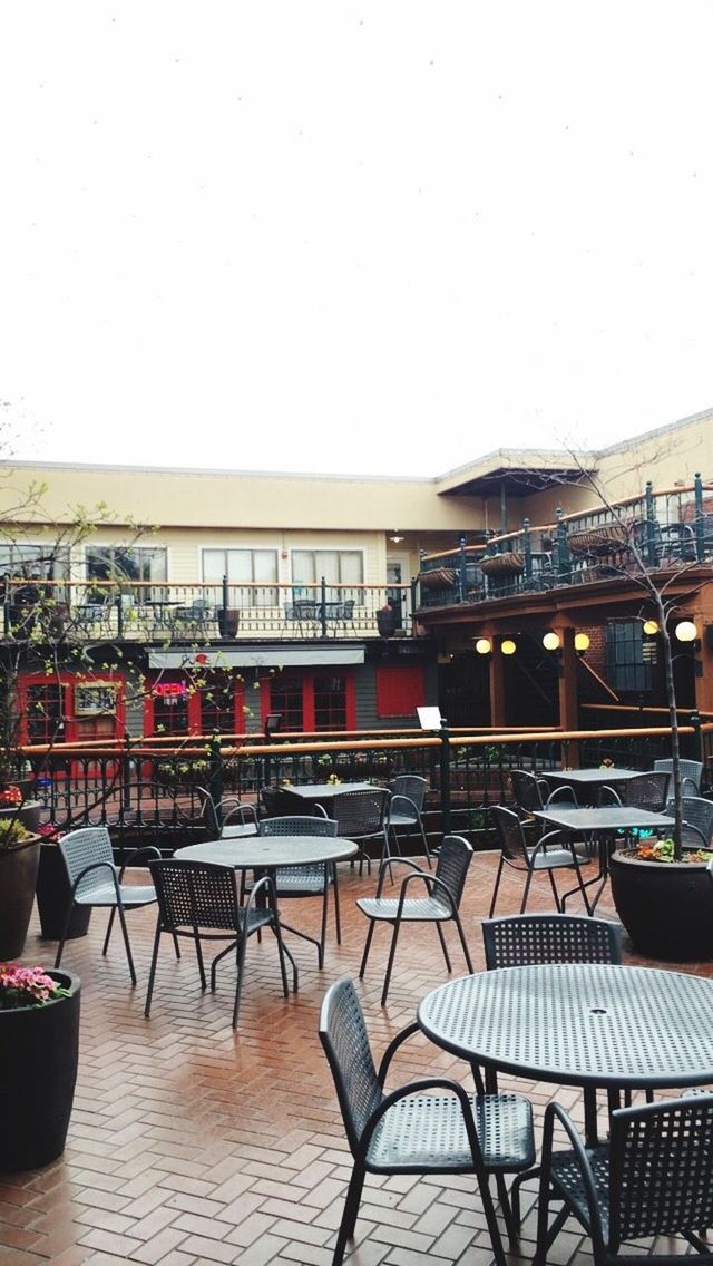 EMPTY CHAIRS AND TABLES IN RESTAURANT