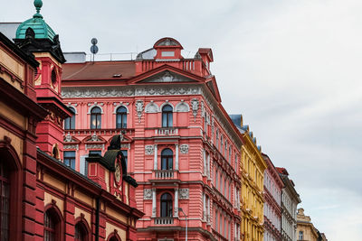 Low angle view of colorful buildings against sky in prague 