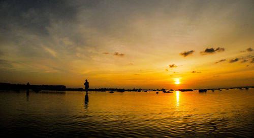 Scenic view of sea at sunset