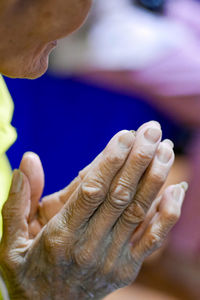 Close-up of man holding hands