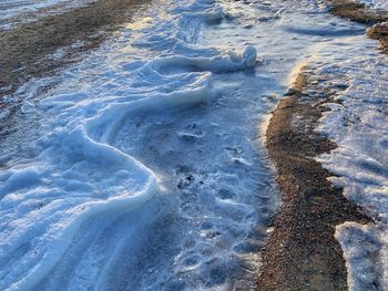 High angle view of frozen sea shore