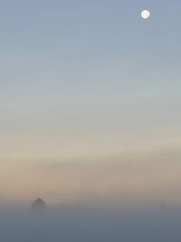 Scenic view of sea against sky at dusk