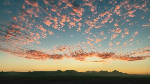 Scenic view of silhouette landscape against sky during sunset