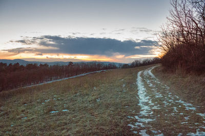 Scenic view of landscape against sky during sunset