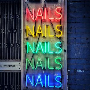 Close-up of illuminated text on wall