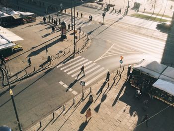 High angle view of people walking on city street