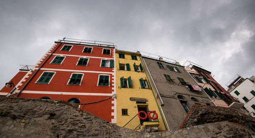 Low angle view of red building against sky