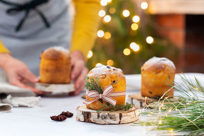 Midsection of christmas tree on table