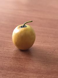 Close-up of fruit on wooden table