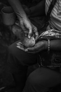 Cropped image of woman holding food