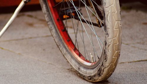 Close-up of old bicycle on street