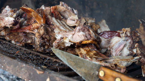 Close-up of meat on barbecue grill