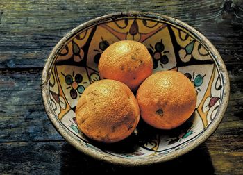 High angle view of fruits in plate on table