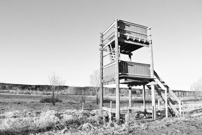 Built structure on field against clear sky
