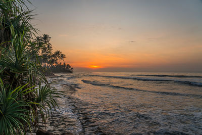 Scenic view of sea against sky during sunset