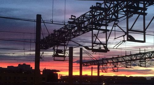 Low angle view of power lines against sky