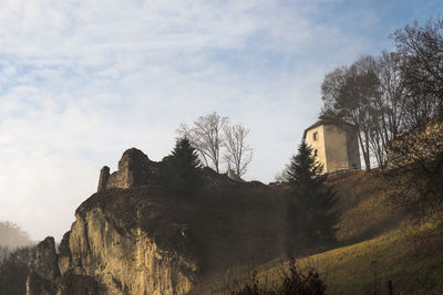 Low angle view of ojcow castle against sky