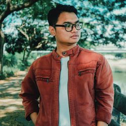 Young man looking away outdoors