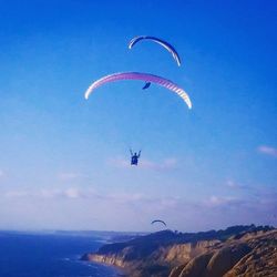 Hot air balloons flying over blue sky