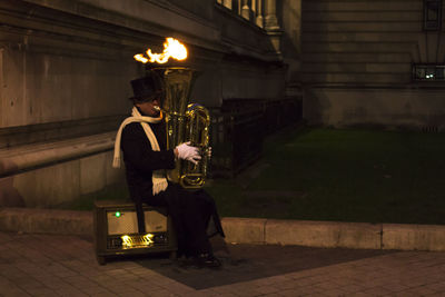 Man playing guitar at music concert