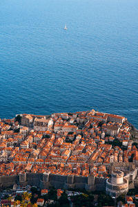 High angle view of townscape by sea