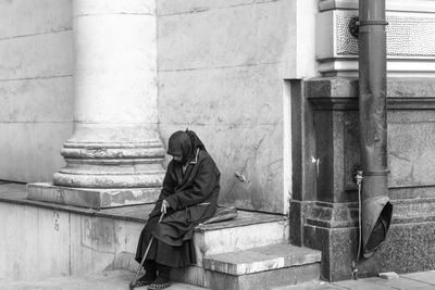 Woman sitting on steps