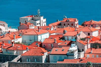 High angle view of townscape against blue sky