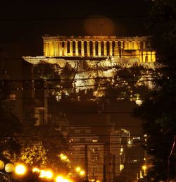 Low angle view of building lit up at night