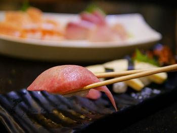 Close-up of meat on barbecue grill