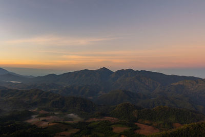 Scenic view of mountains against sky during sunset