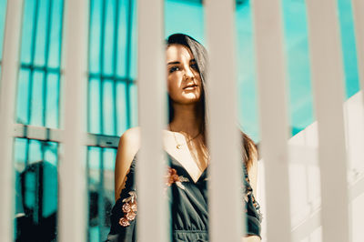 Portrait of a smiling young woman standing outdoors