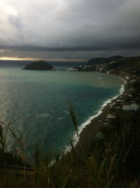 Scenic view of sea against cloudy sky