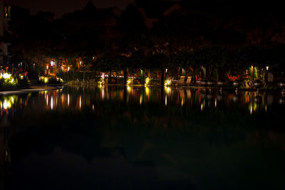 Reflection of illuminated buildings in lake at night