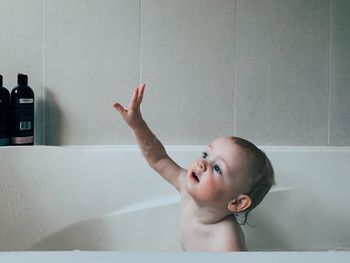 Portrait of cute boy in bathroom